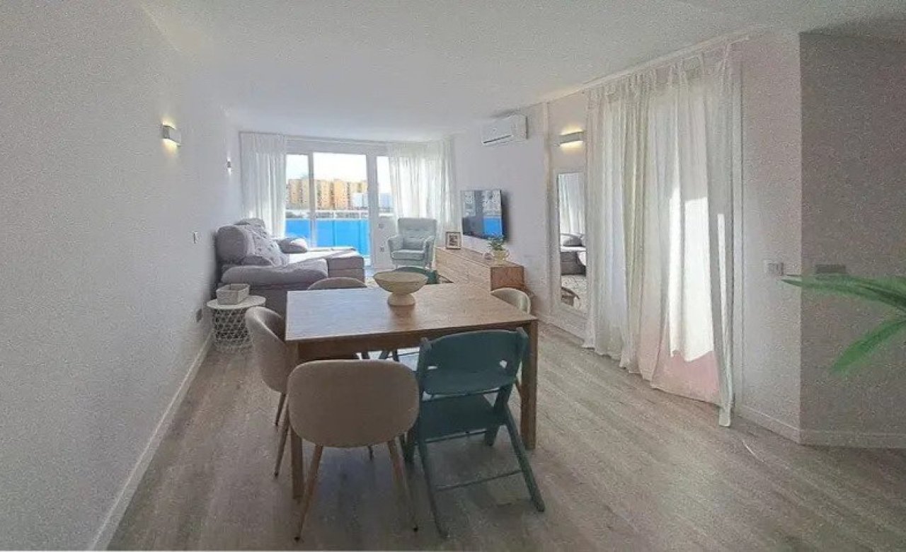 Living and dining area with seamless transitions and access to the terrace