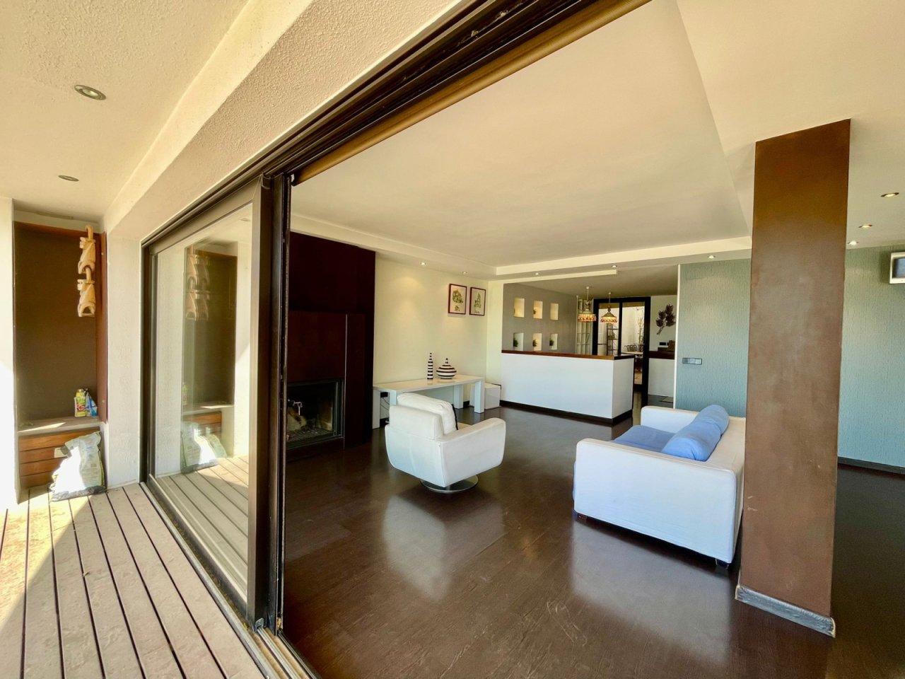 Living area with seamless transitions and large sliding doors to the outdoor space Living area with seamless transitions and large sliding doors to the outdoor space