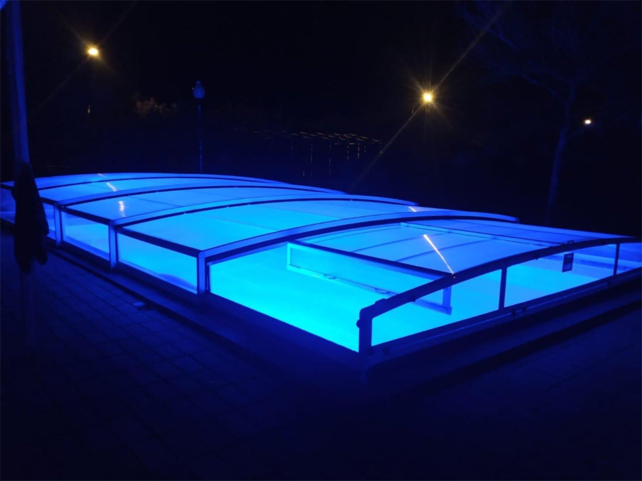 Swimming pool with modern LED lighting and professional covering system