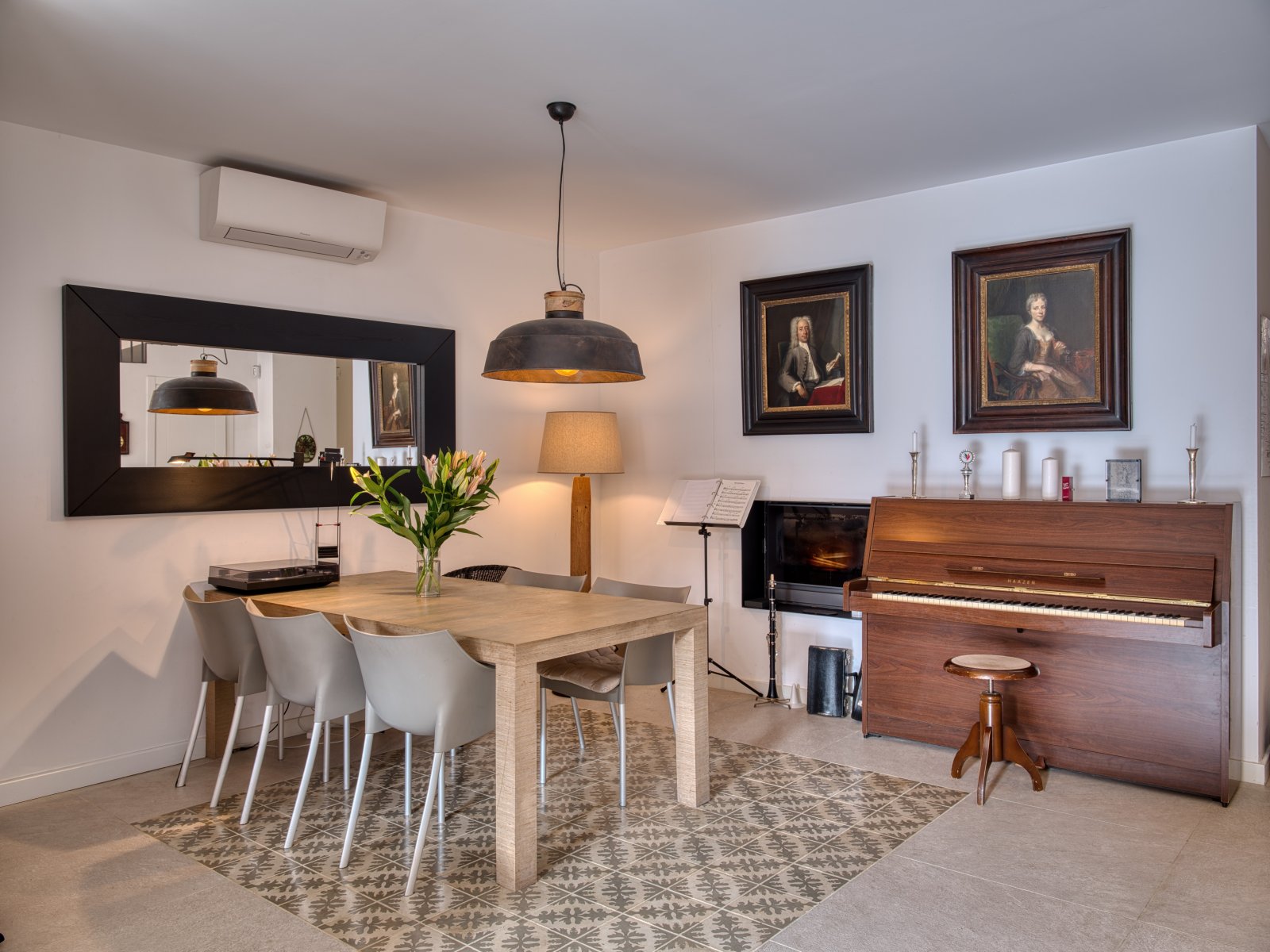 Elegant living and music room with open layout and air conditioning Elegant living and music room with open layout and air conditioning