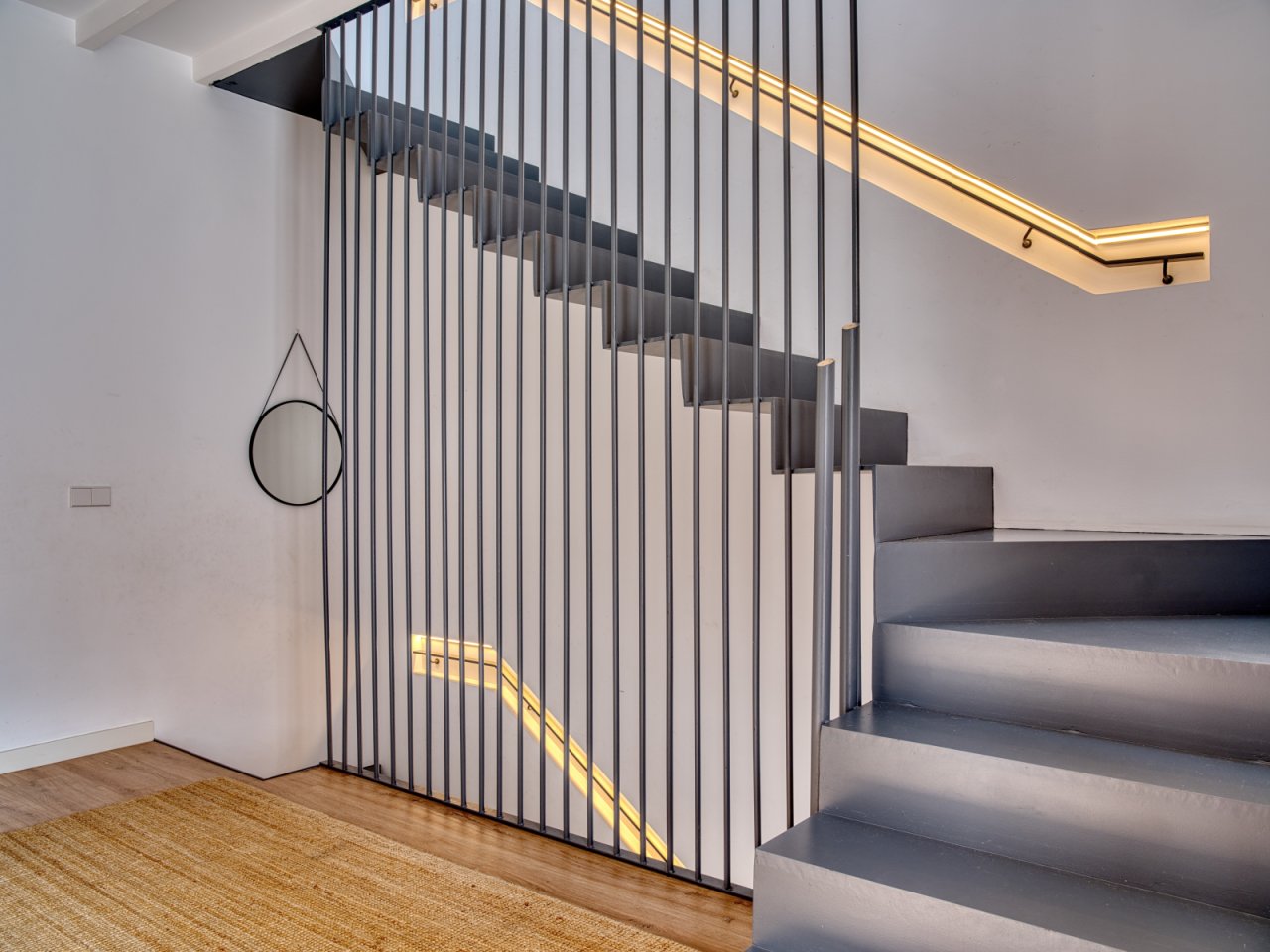 Modern staircase hall with skylight glazing and elegant rod balustrade construction Modern staircase hall with skylight glazing and elegant rod balustrade construction