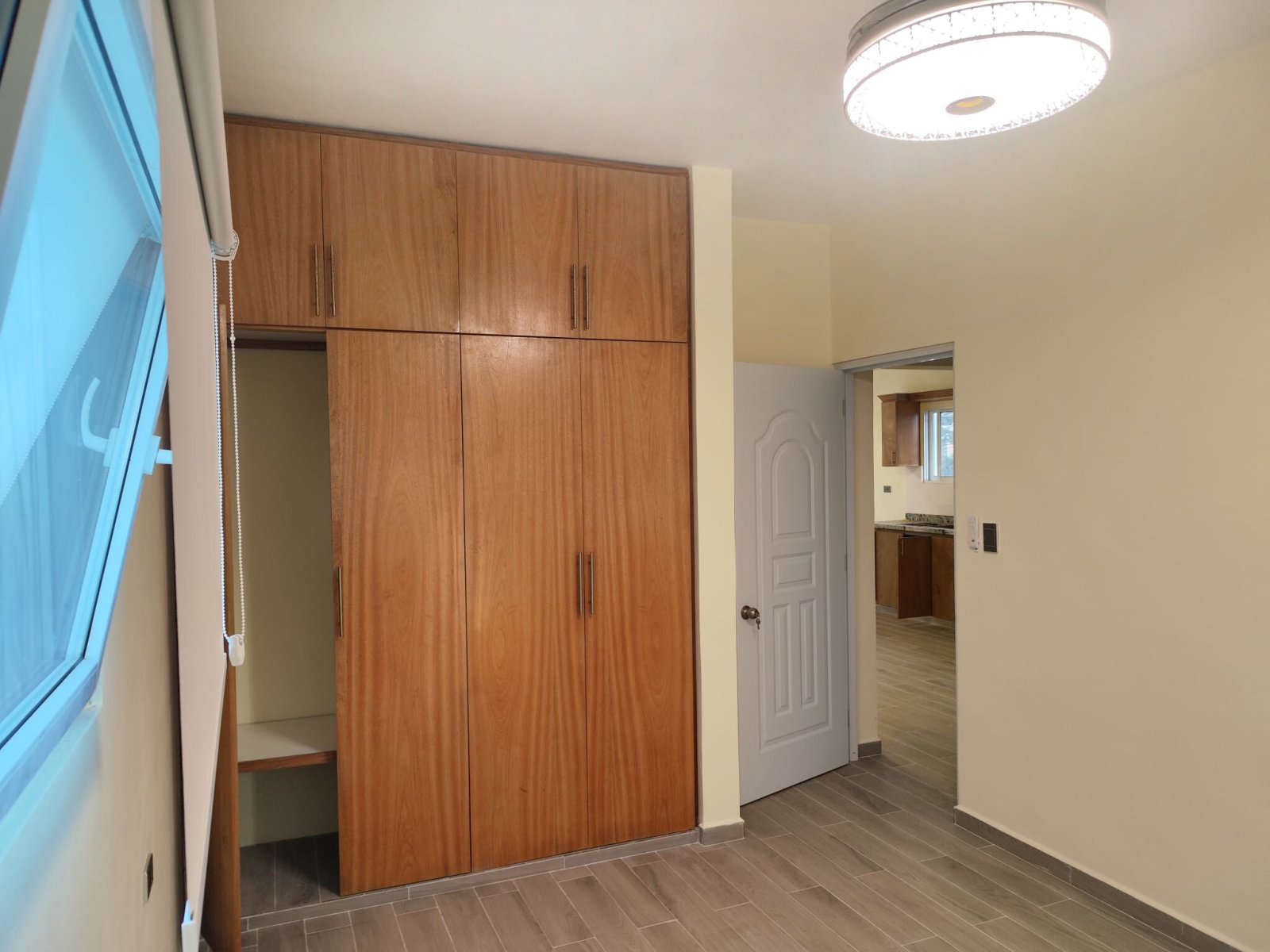 Bedroom with extensive built-in wardrobe and optimal storage solution Bedroom with extensive built-in wardrobe and optimal storage solution