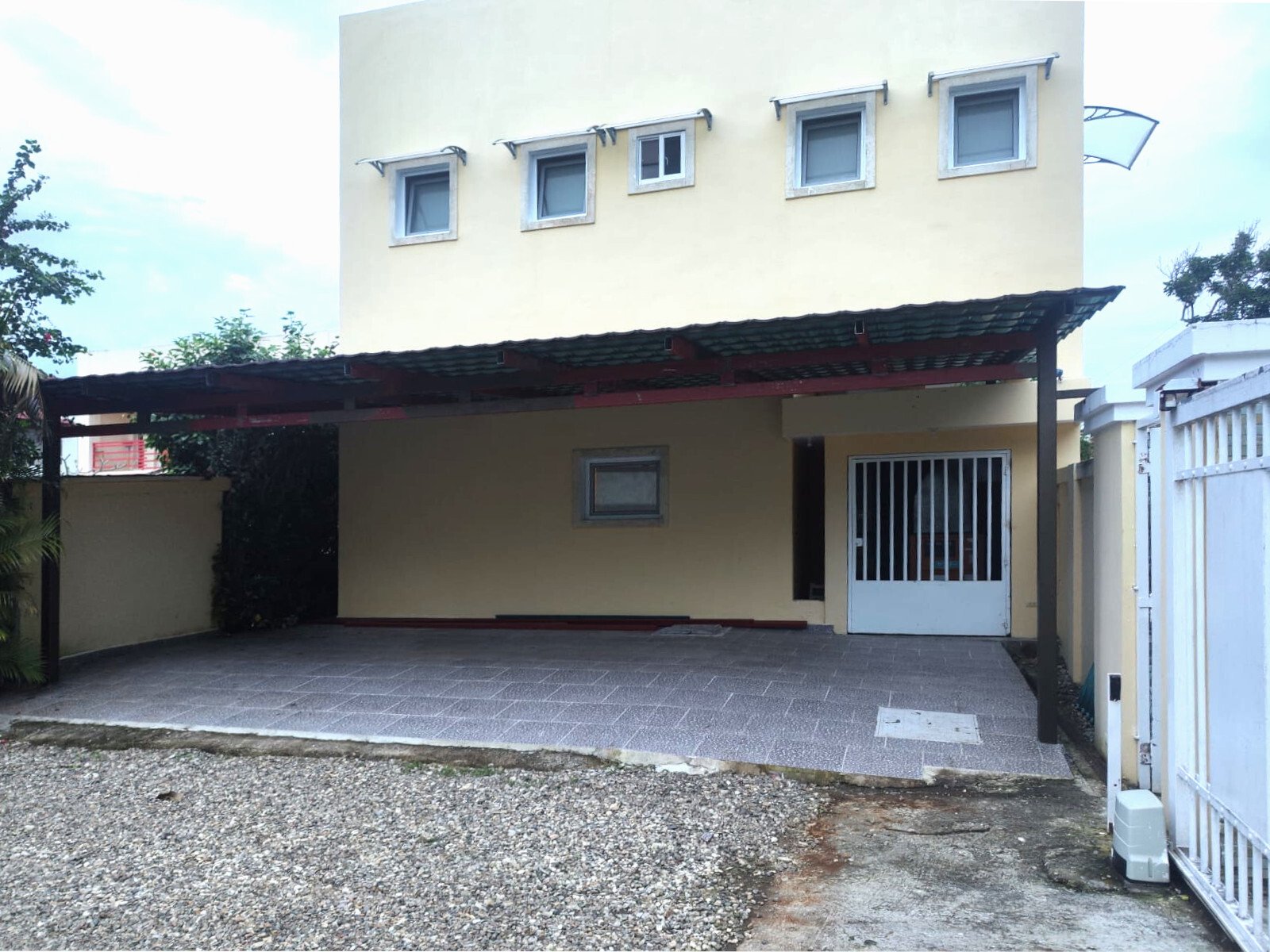 Functional outdoor area with covered terrace and direct house entrance Functional outdoor area with covered terrace and direct house entrance