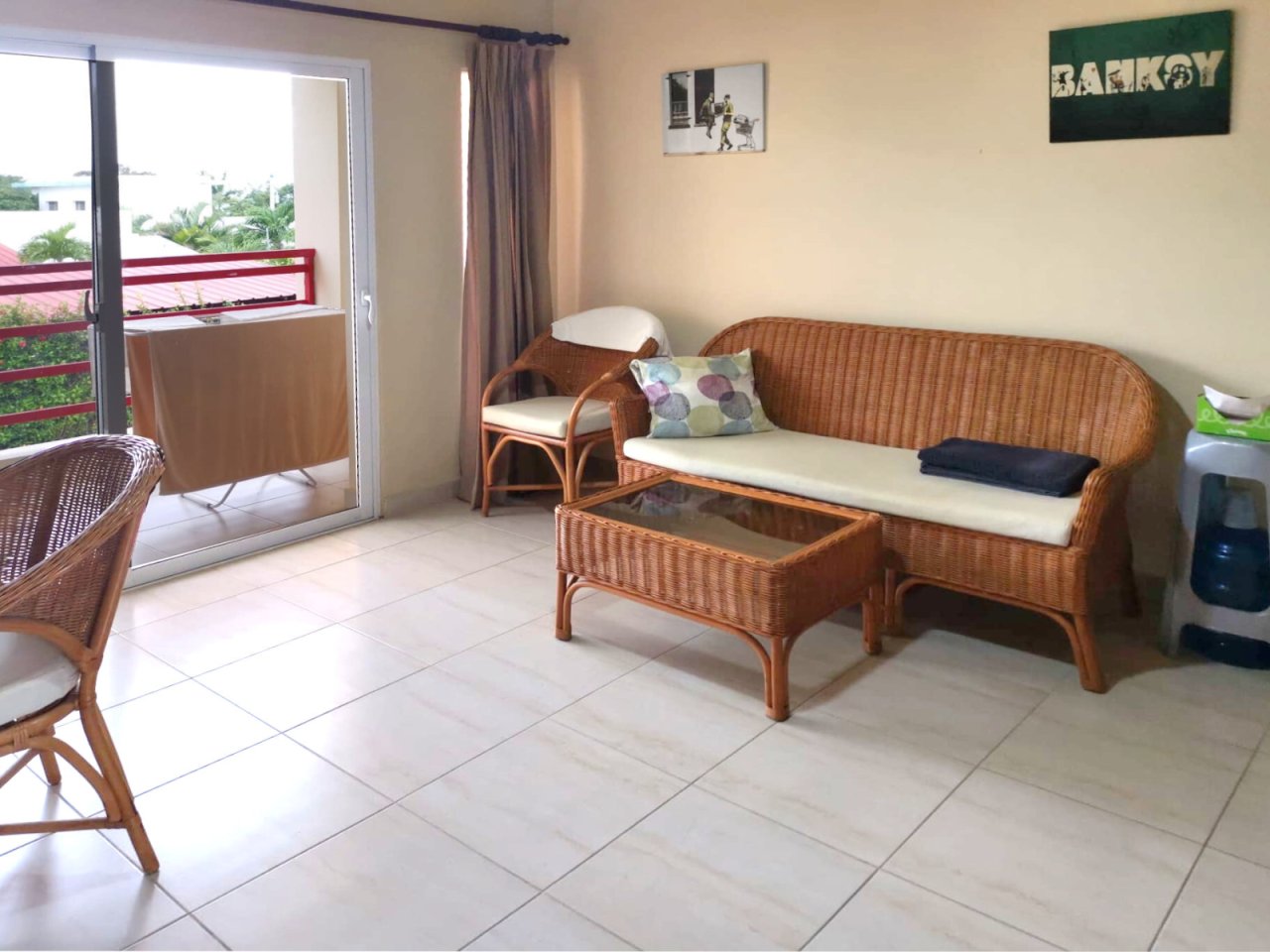 Bright living room with direct balcony access and optimal space utilization