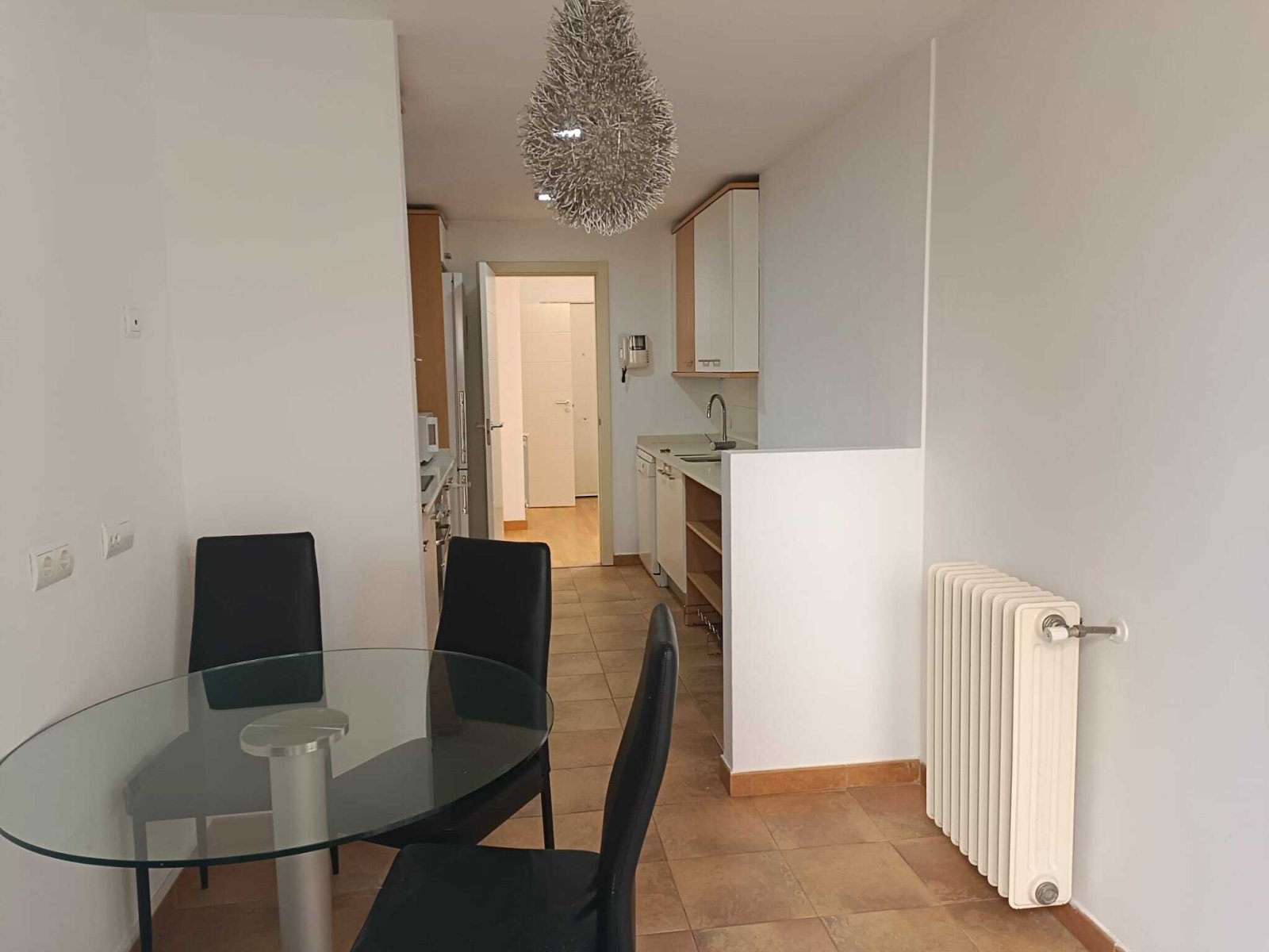Open kitchen-living area with smart space design – seamless connection of cooking and living