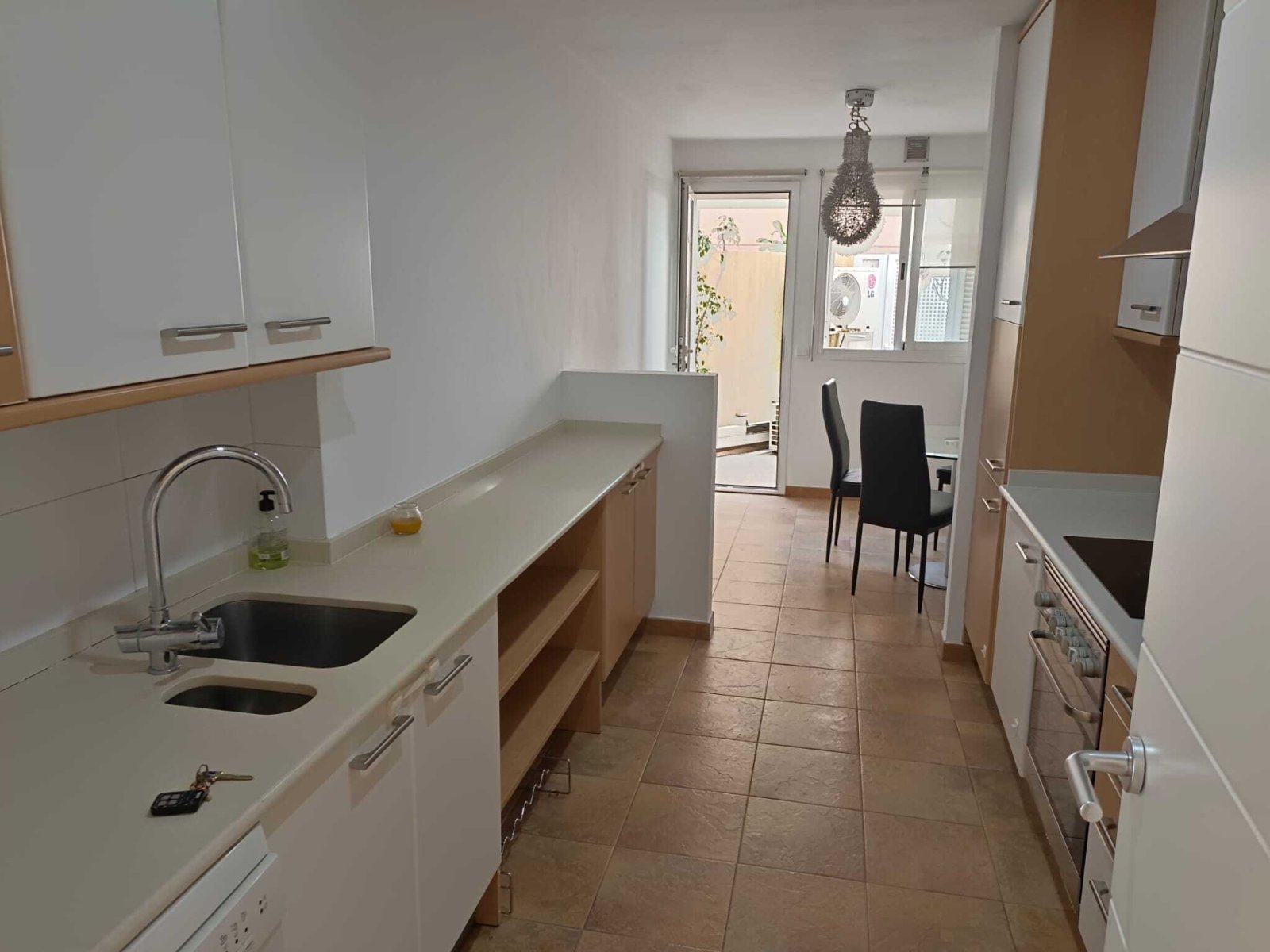 Functional galley kitchen with a well-designed workflow and access to the living area