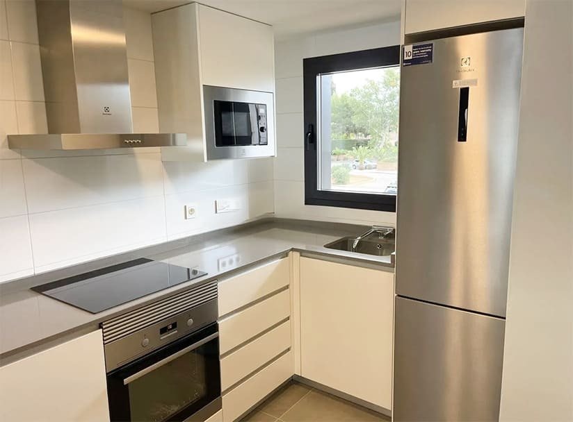 Modern kitchen with high-quality equipment and a practical window seat Modern kitchen with high-quality equipment and a practical window seat