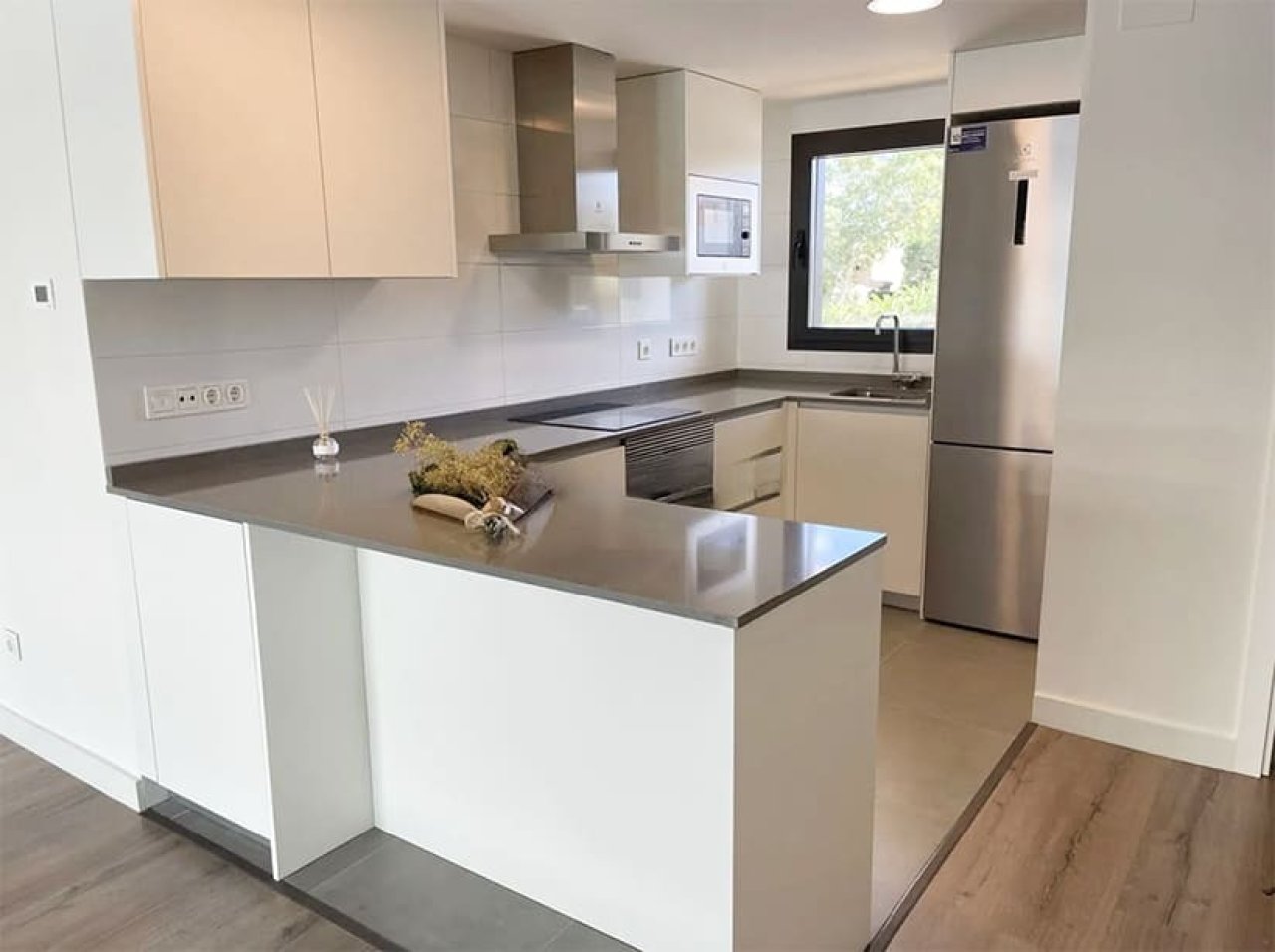 Modern kitchen with central island and intelligent layout Modern kitchen with central island and intelligent layout