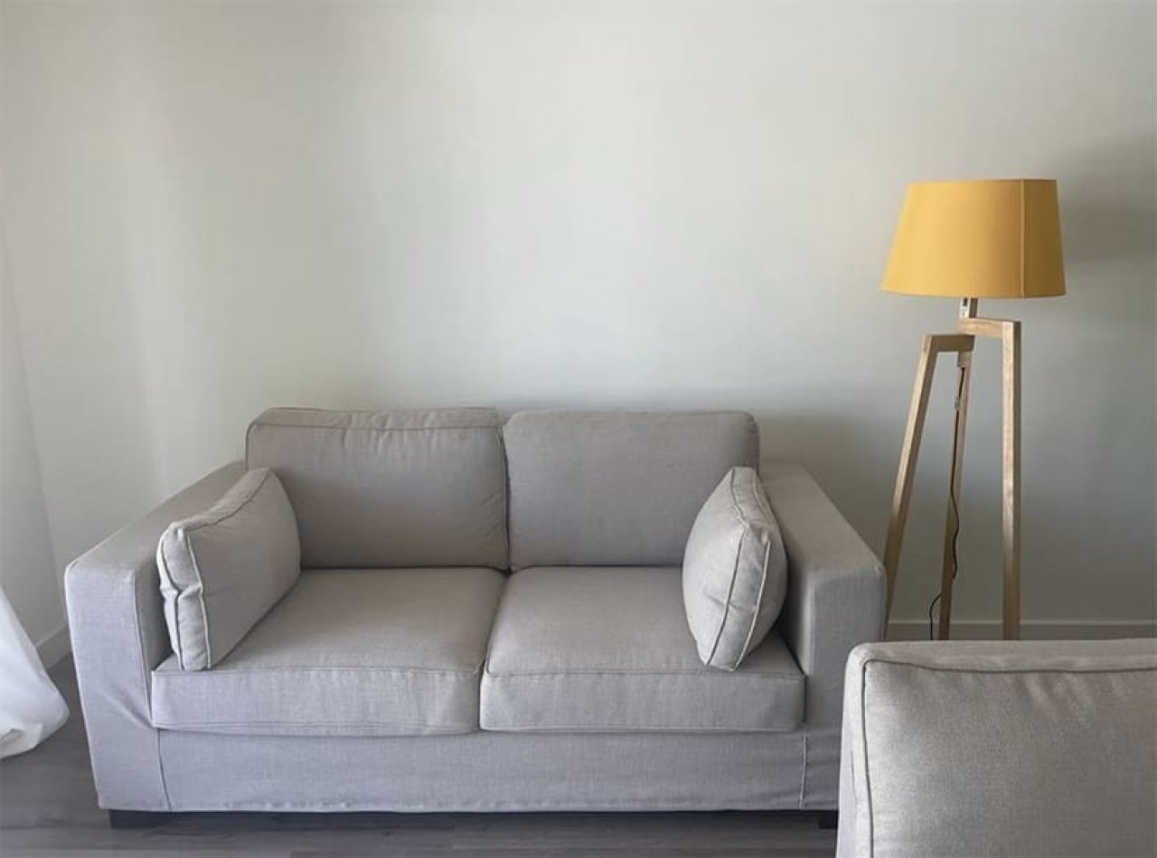 Bright living room with generous ceiling height and optimal wall space for flexible furniture arrangement. Bright living room with generous ceiling height and optimal wall space for flexible furniture arrangement.
