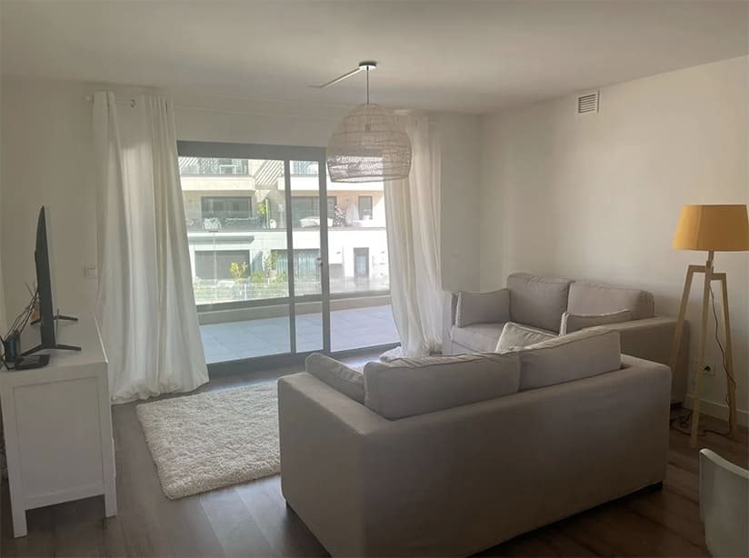Bright living room with direct balcony access and panoramic windows Bright living room with direct balcony access and panoramic windows