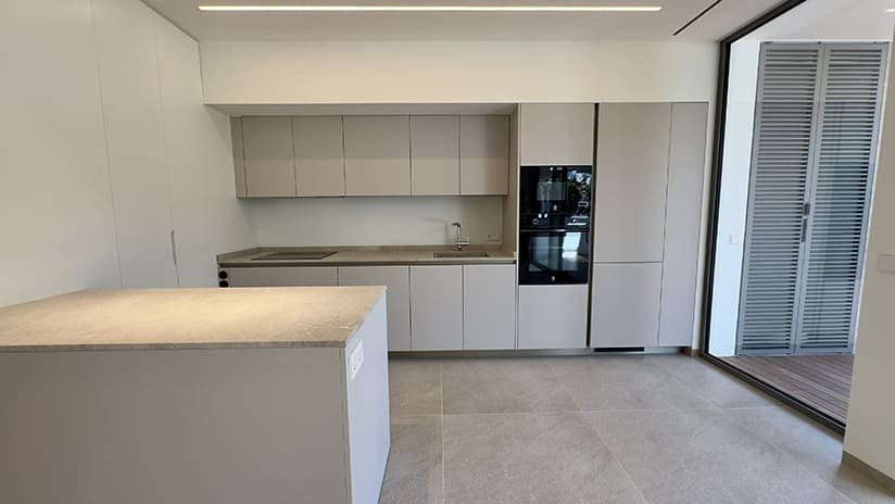Modern kitchen with island and high-quality built-in appliances Modern kitchen with island and high-quality built-in appliances