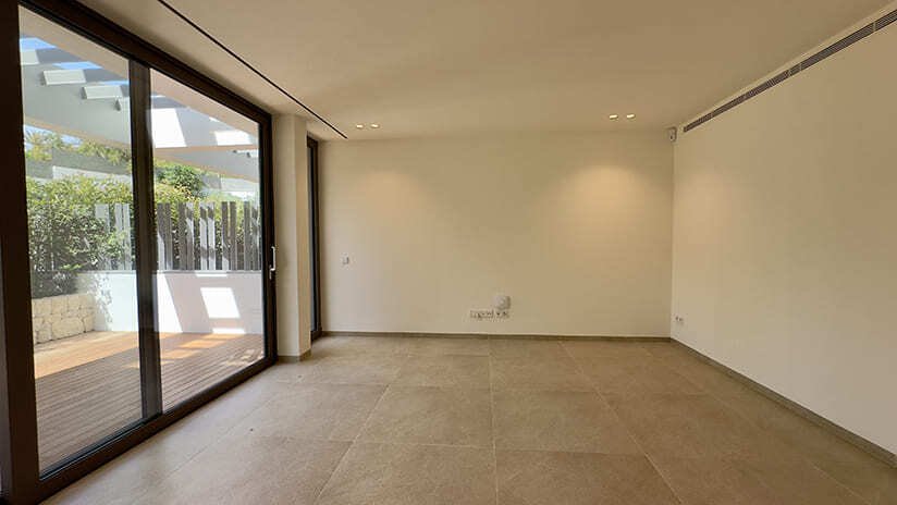 Bright living room with direct access to the terrace and large sliding doors Bright living room with direct access to the terrace and large sliding doors