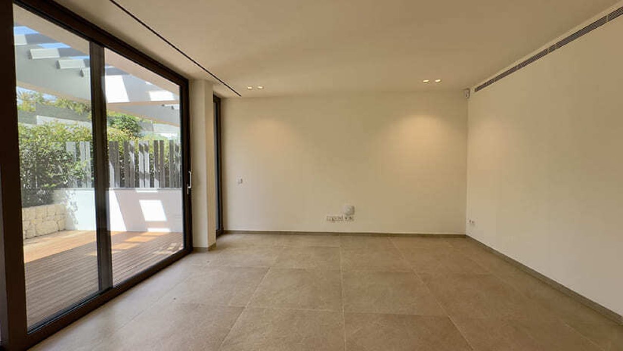 Bright living room with direct access to the terrace and large sliding doors Bright living room with direct access to the terrace and large sliding doors