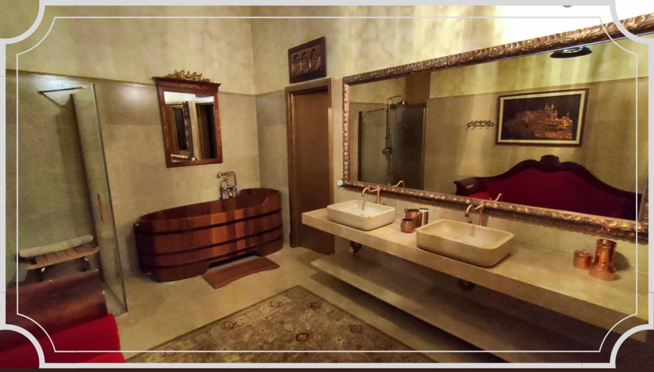 Luxurious bathroom with double vanity and walk-in shower Luxurious bathroom with double vanity and walk-in shower