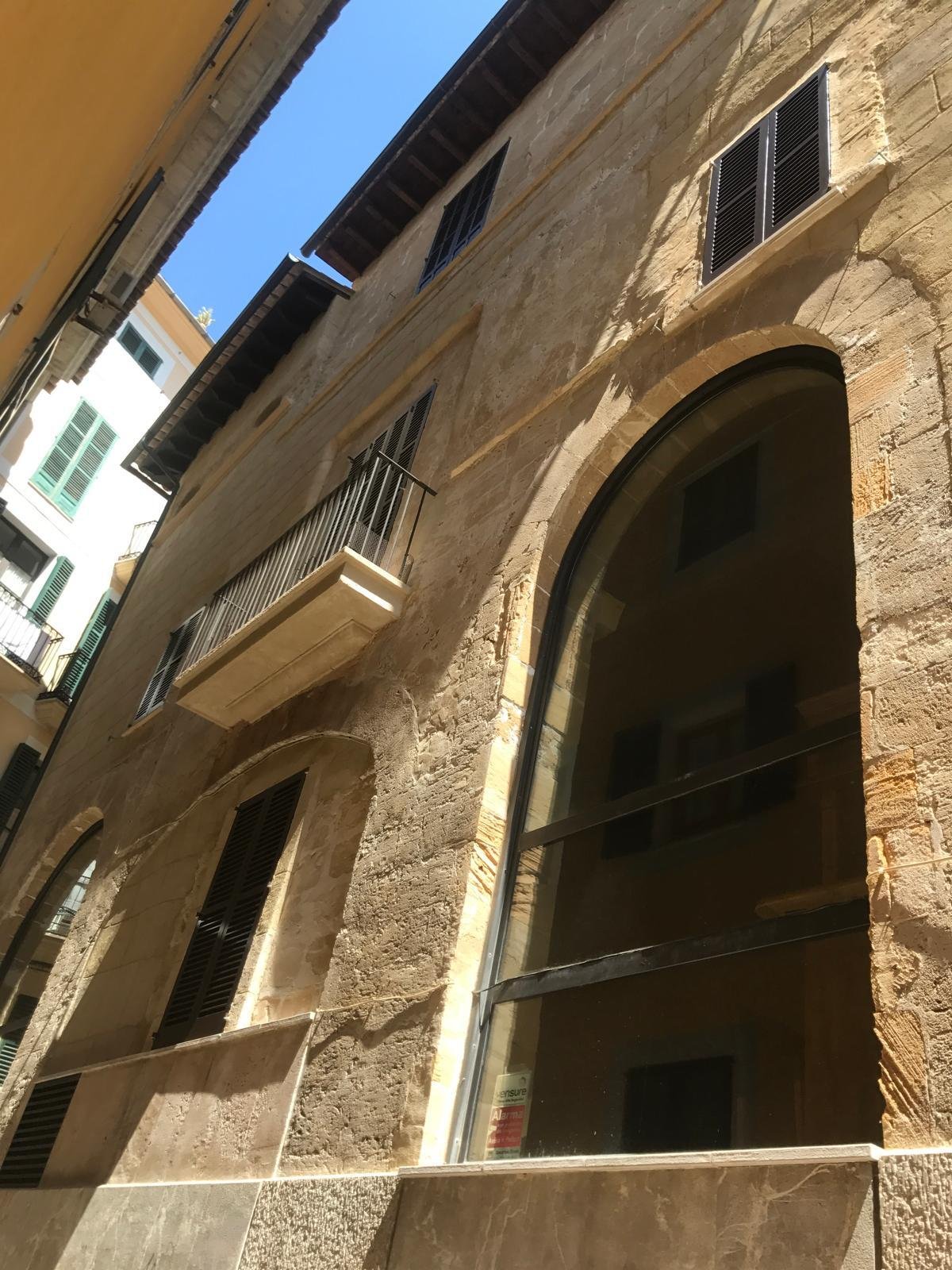 Characterful facade with elegant rounded arch openings and authentic natural stone texture Characterful facade with elegant rounded arch openings and authentic natural stone texture