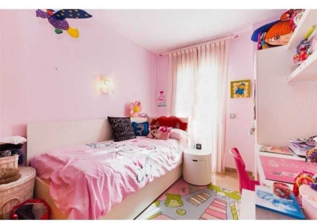 Children's room with practical built-in storage solutions and optimal lighting through terrace access Children's room with practical built-in storage solutions and optimal lighting through terrace access
