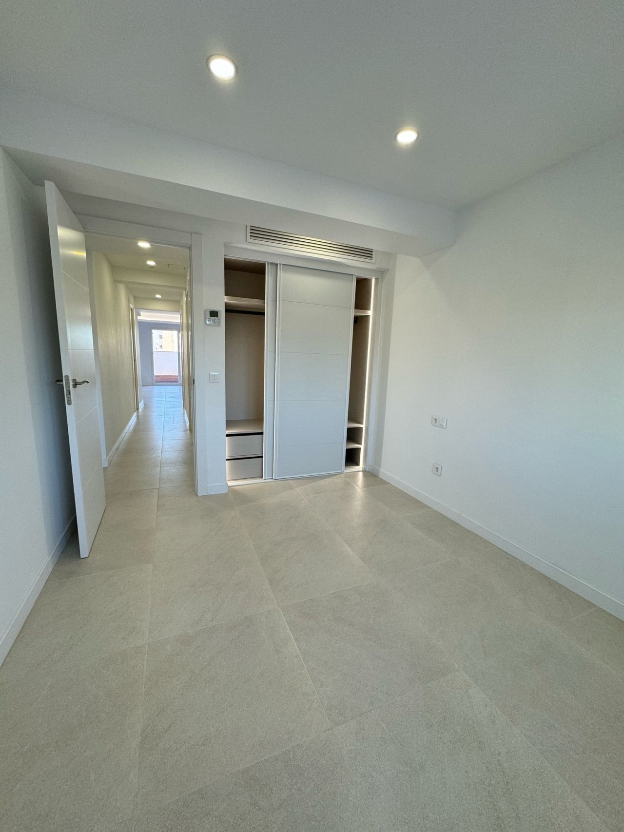 Walk-in closet with intelligent space utilization and custom-built systems