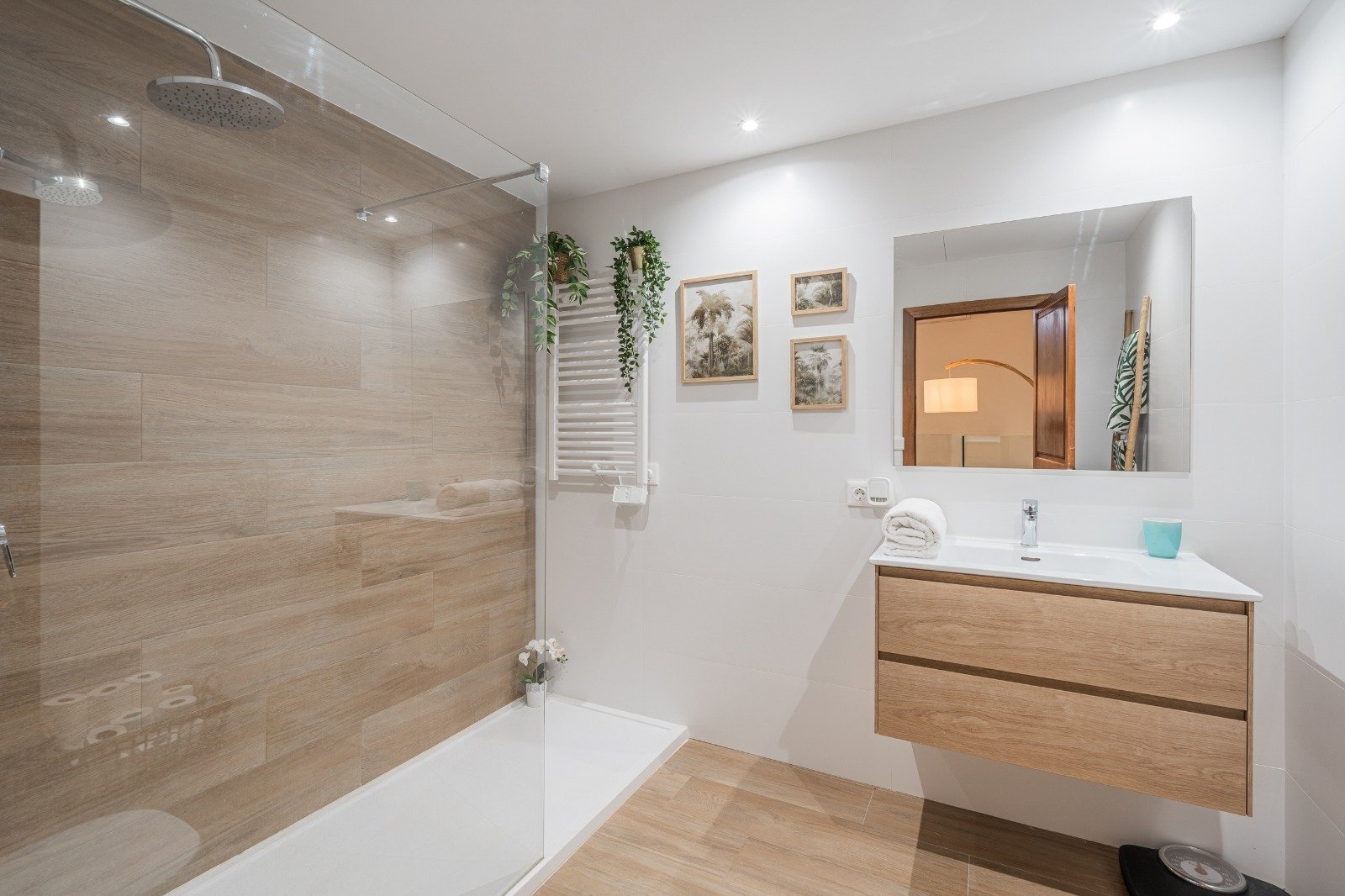 Modern bathroom with walk-in shower, double washbasin, and high-quality fittings