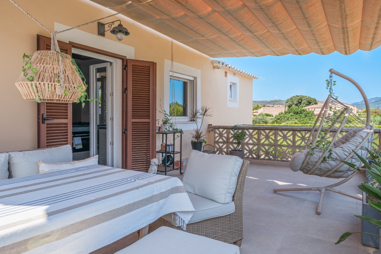 Main bedroom with direct terrace access and covered outdoor area
