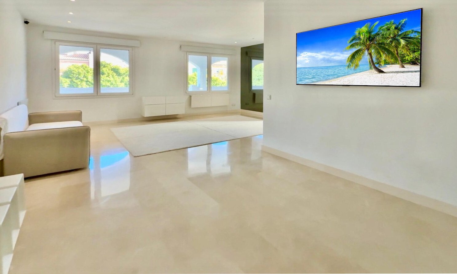 Bright living room with large windows and high-quality surfaces Bright living room with large windows and high-quality surfaces
