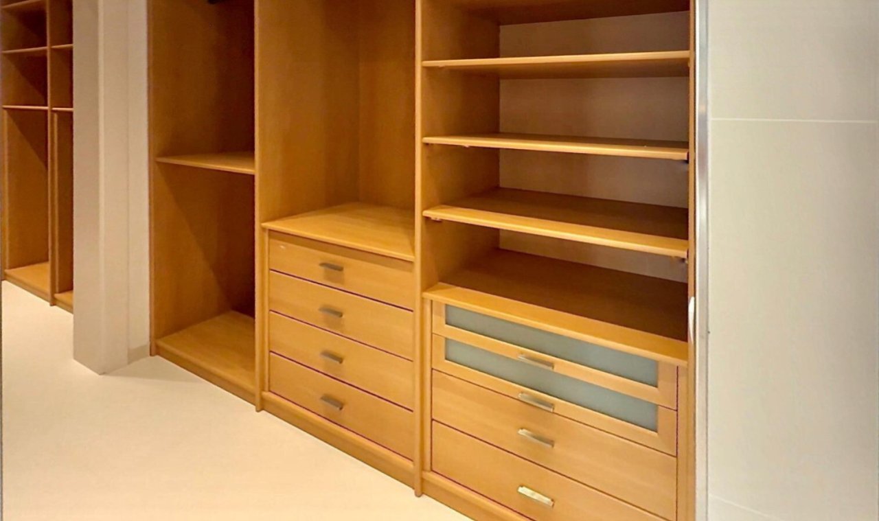 Custom dressing area with comprehensive storage solutions and high-quality wood craftsmanship Custom dressing area with comprehensive storage solutions and high-quality wood craftsmanship
