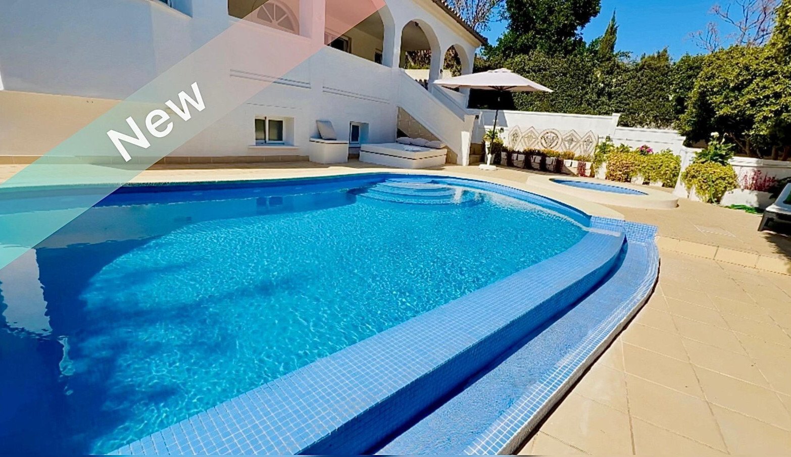 Refreshing swimming pool with professionally designed pool edge and sunny open area Refreshing swimming pool with professionally designed pool edge and sunny open area