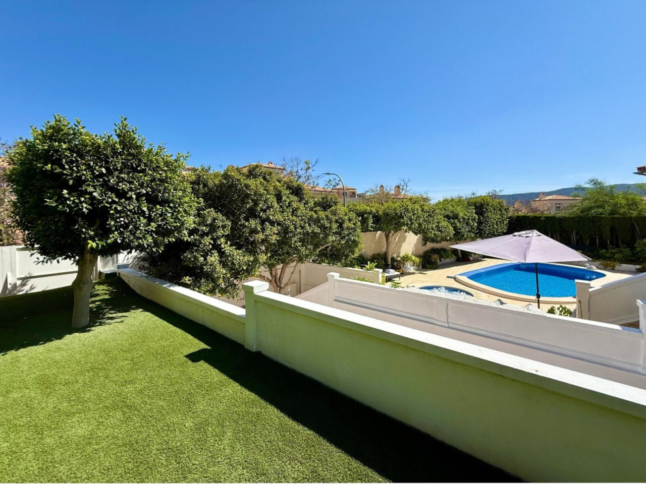 Private garden area with pool, terrace, and structured outdoor space Private garden area with pool, terrace, and structured outdoor space