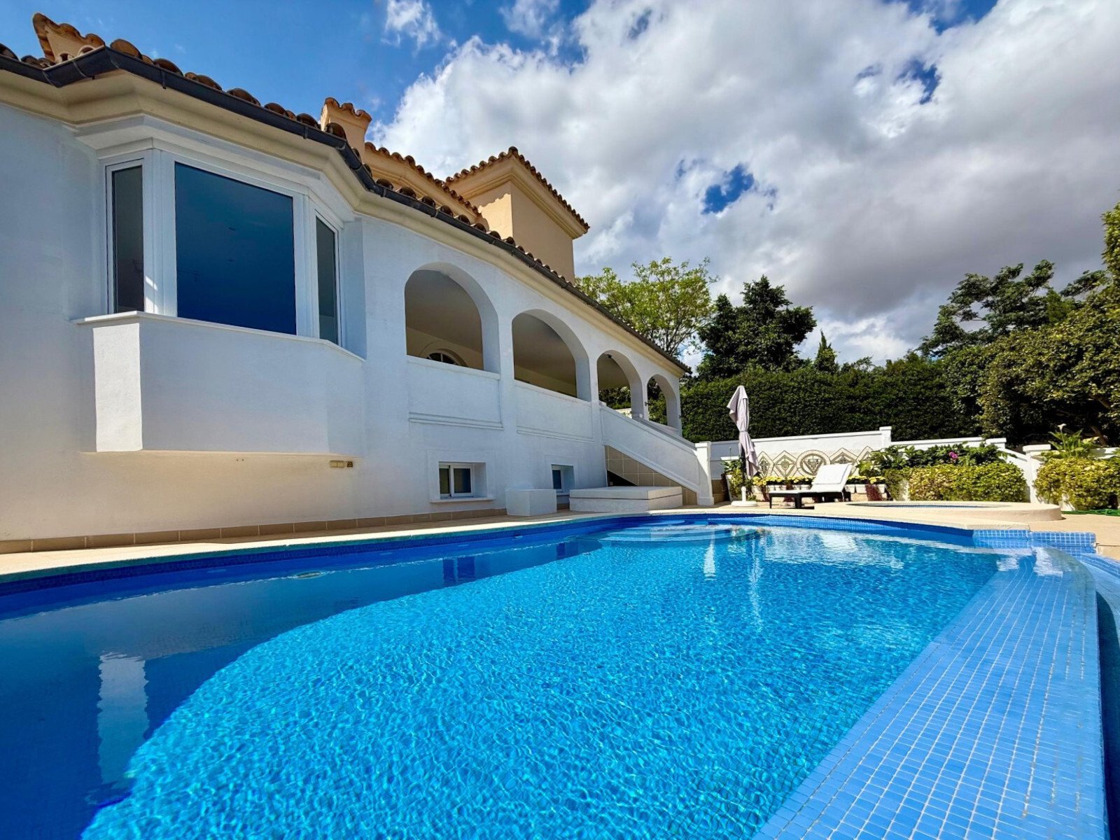 Elegant pool area with a spacious terrace and direct house connection Elegant pool area with a spacious terrace and direct house connection