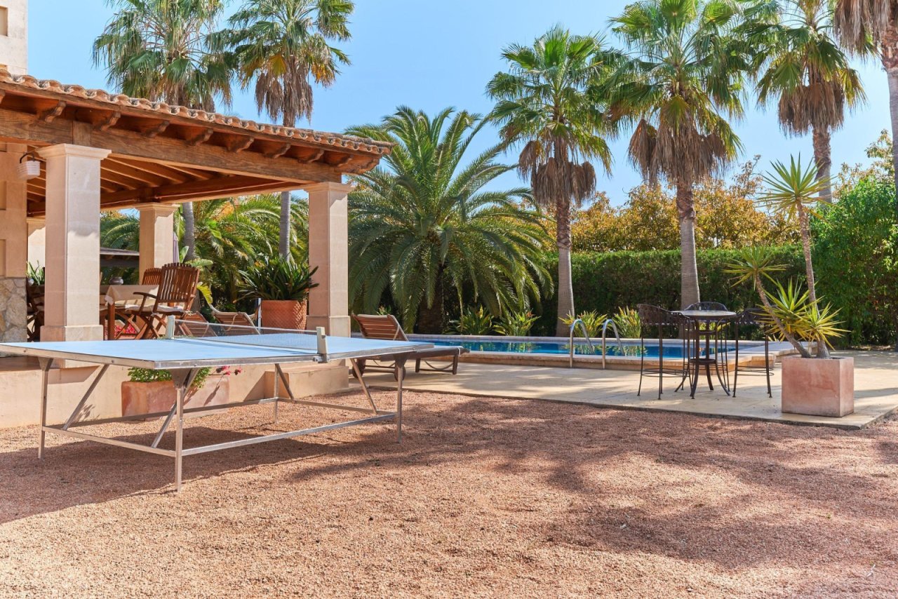 Outdoor living area with pool, pergola, and versatile usage zones Outdoor living area with pool, pergola, and versatile usage zones