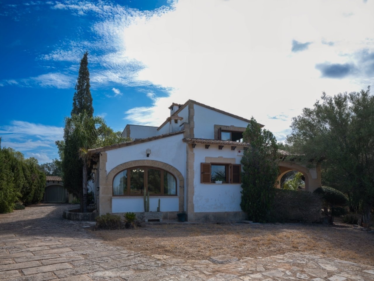 Mediterranean architecture with elegant rounded arch elements and spacious outdoor area