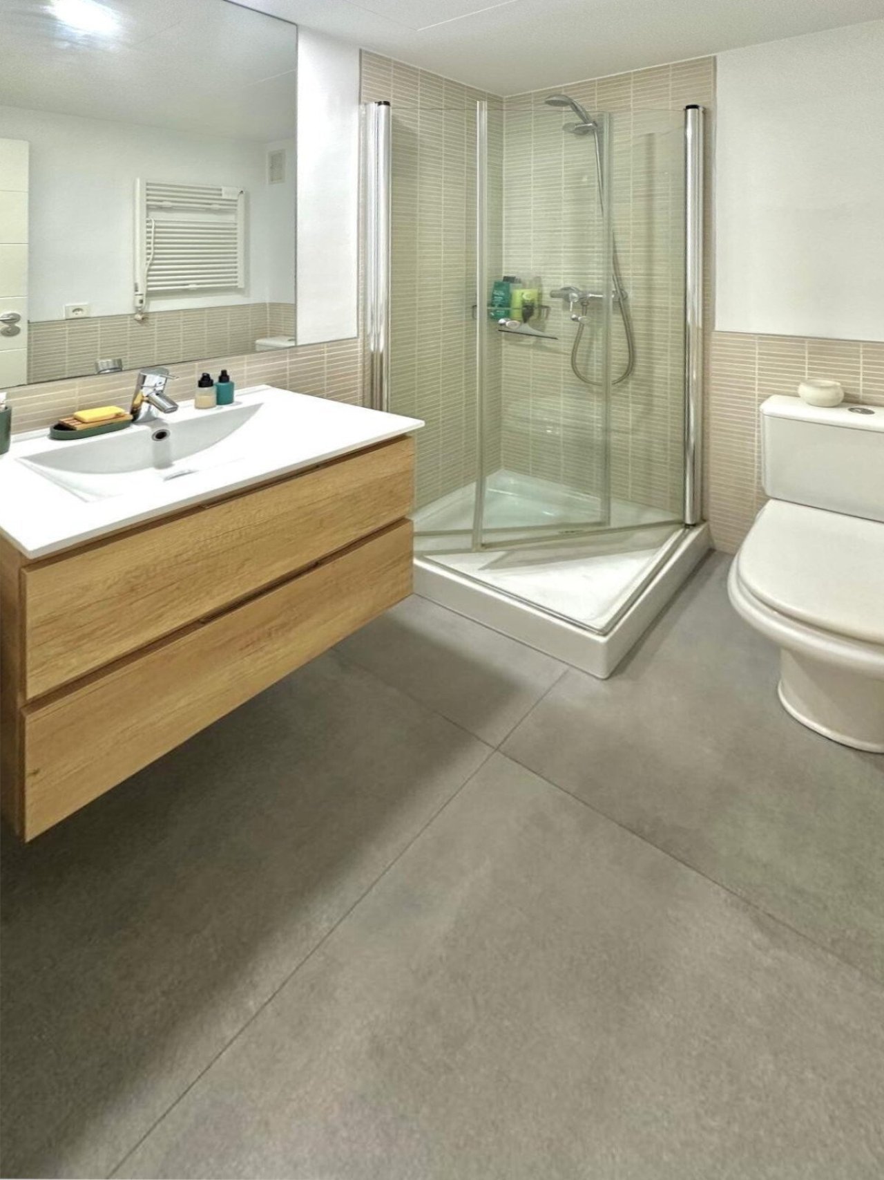 Modern bathroom with walk-in shower and practical layout