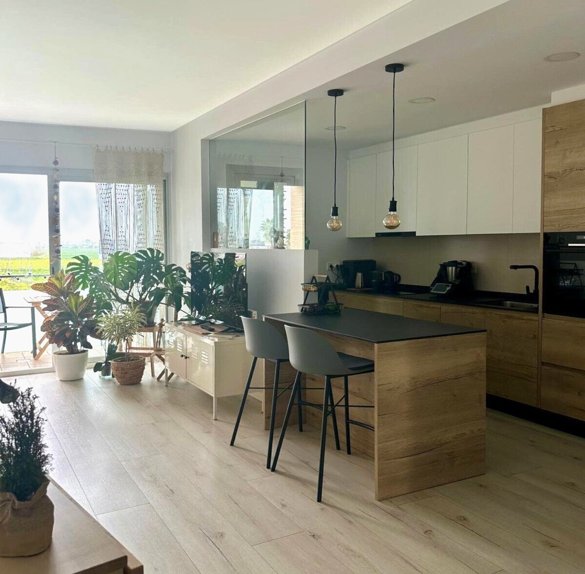 Modern kitchen with central island and integrated dining area