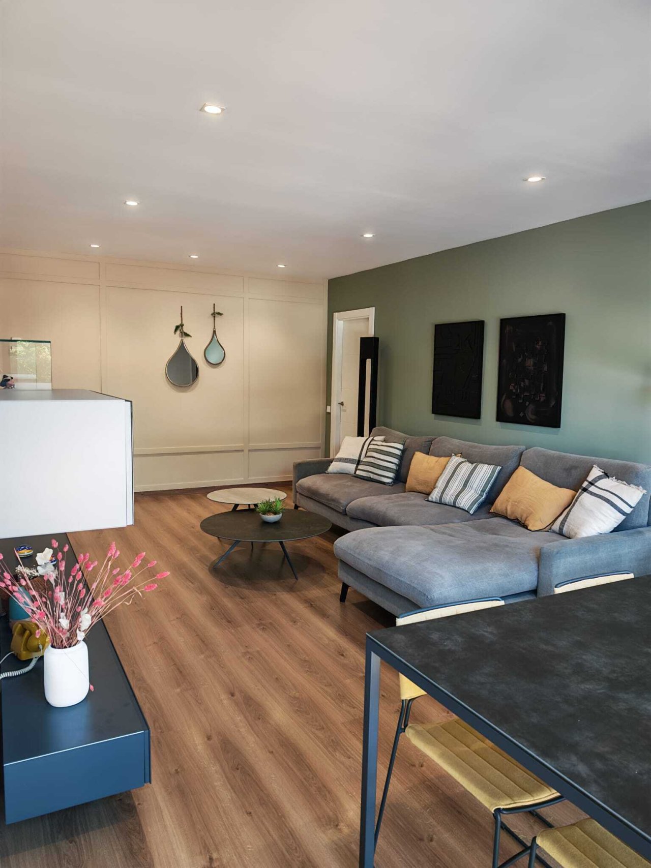 Modern living room with indirect LED ceiling lighting and high-quality wall panels
