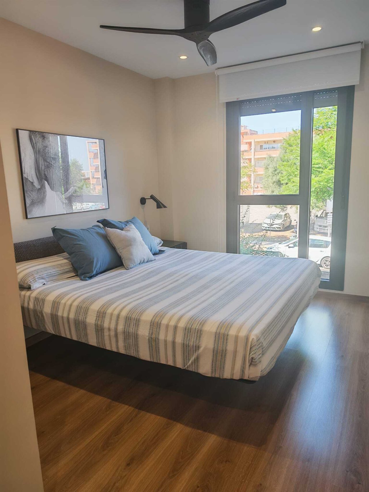 Modern bedroom with French balcony and high-quality ceiling ventilation
