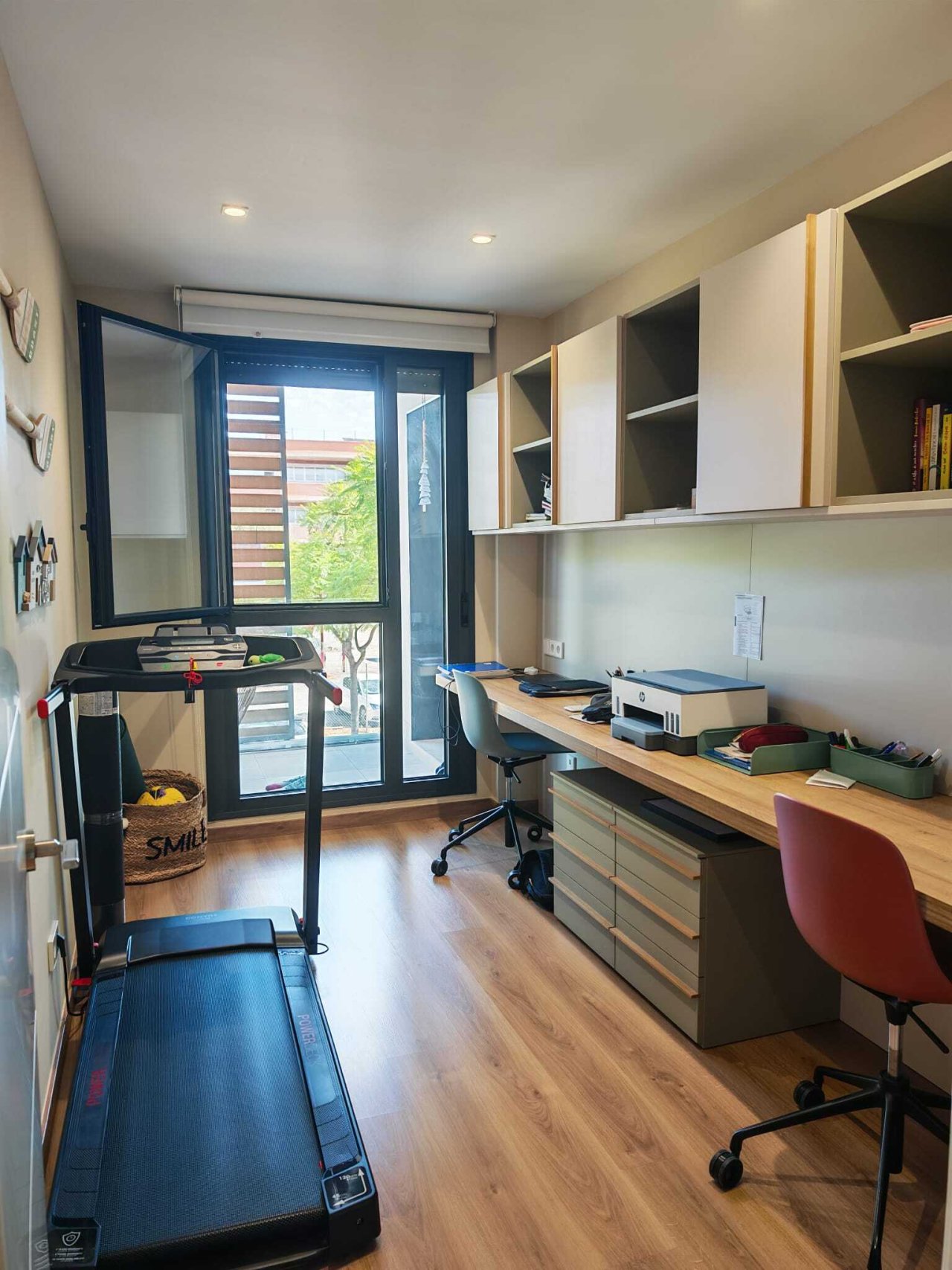 Modern home office with smart storage solution and balcony access