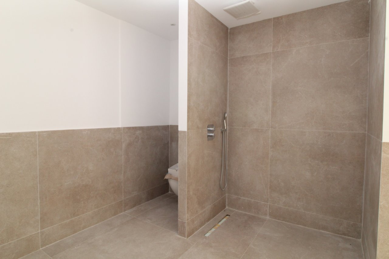 Modern bathroom with walk-in shower and high-quality tile design
