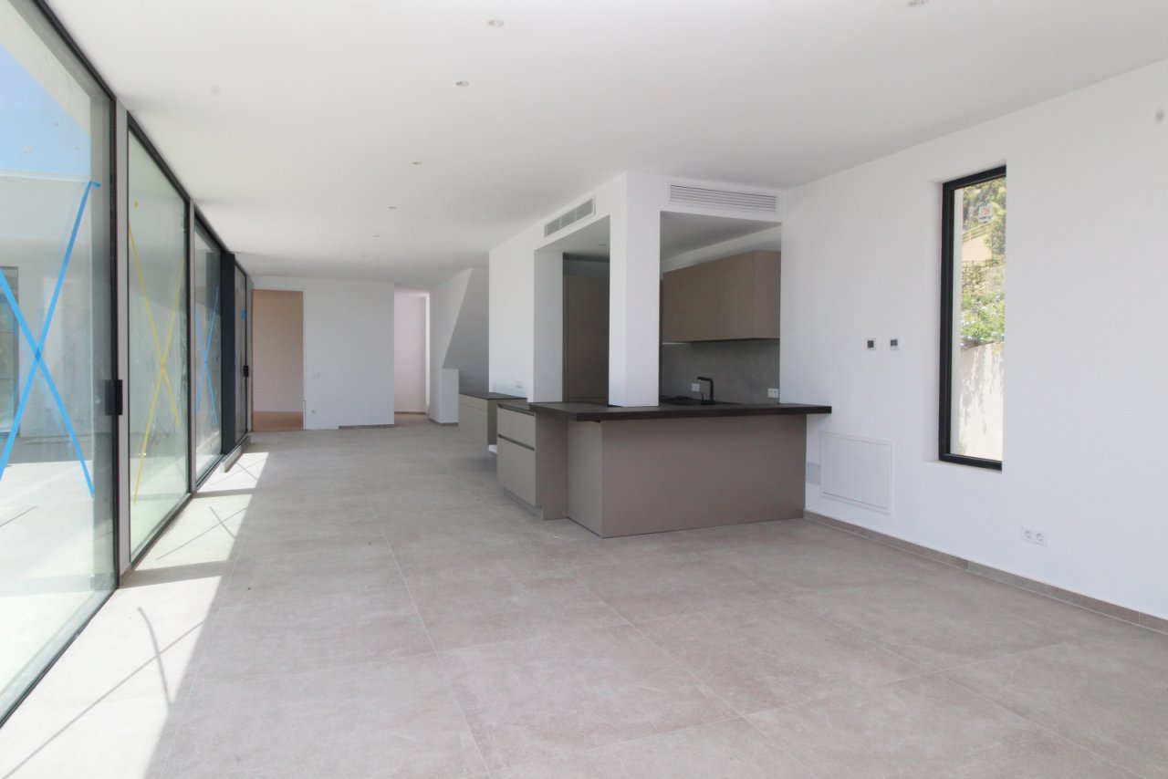 Open living space with a central kitchen island and well-designed flow
