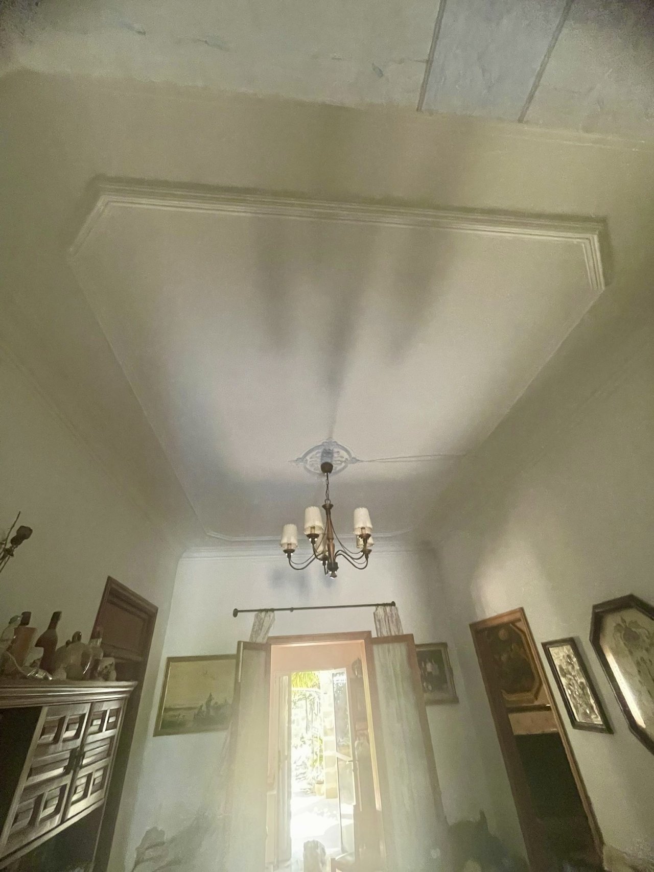 Elegant entrance area with stucco ceiling and classic ceiling light Elegant entrance area with stucco ceiling and classic ceiling light
