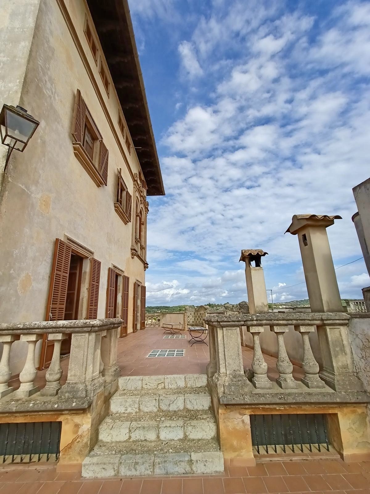 Terrace loggia with a classic balustrade – unobstructed view of the old town and landscape