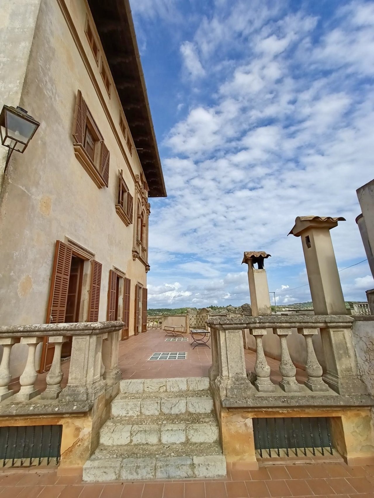 Terrace loggia with a classic balustrade – unobstructed view of the old town and landscape