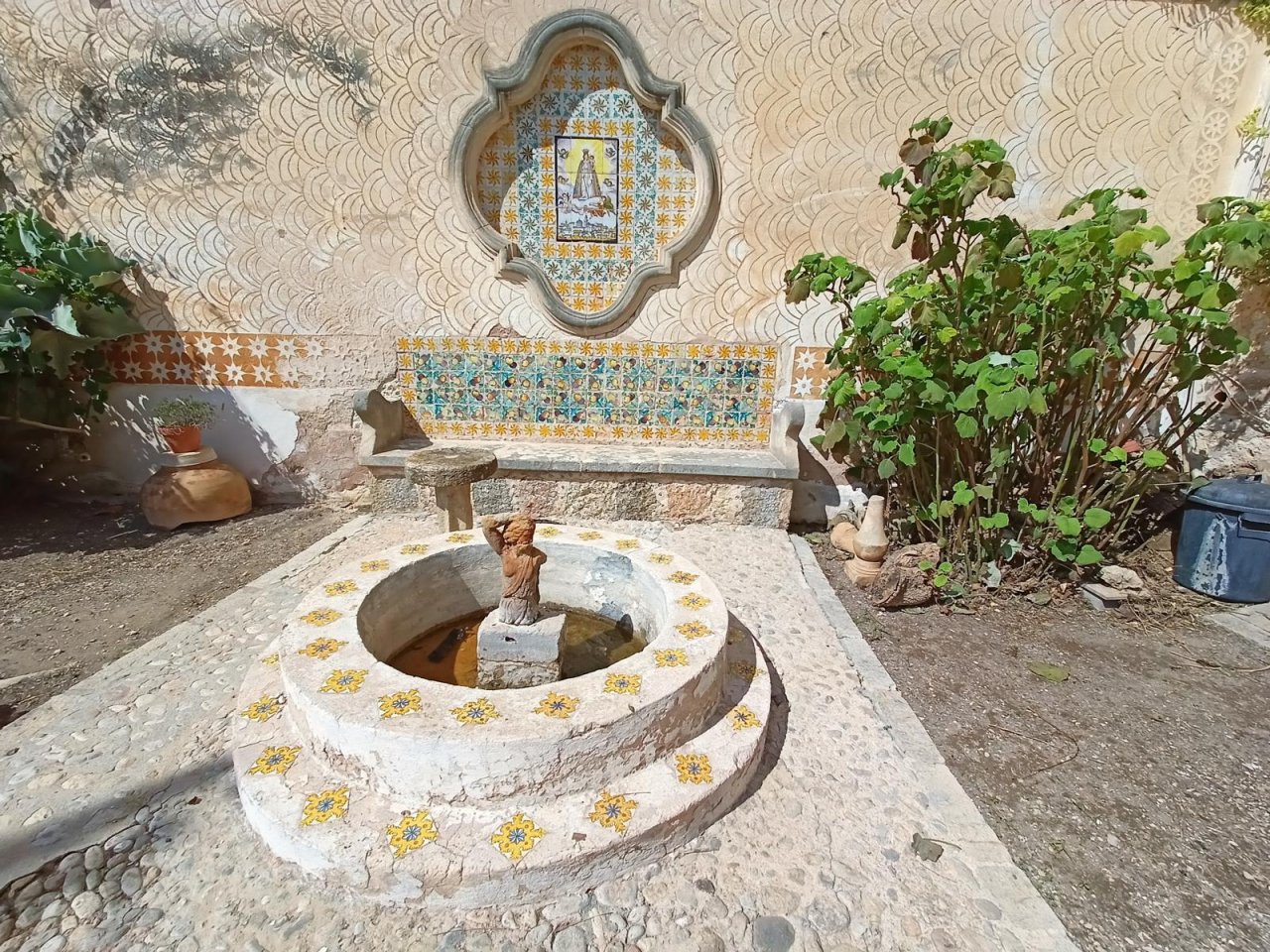 Authentic courtyard with traditional fountain and Moroccan decorative ceramics