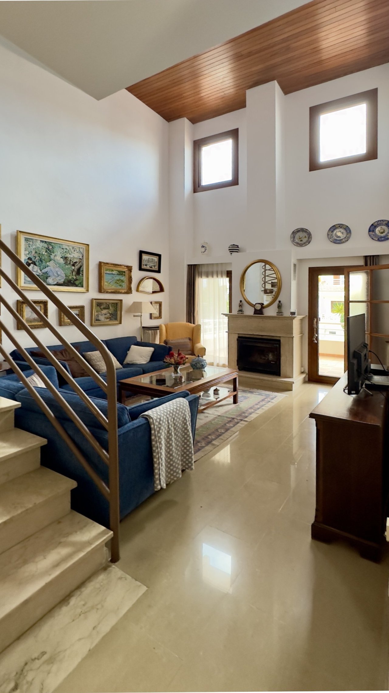 Living area with wood stove – Cozy heat source in open floor plan