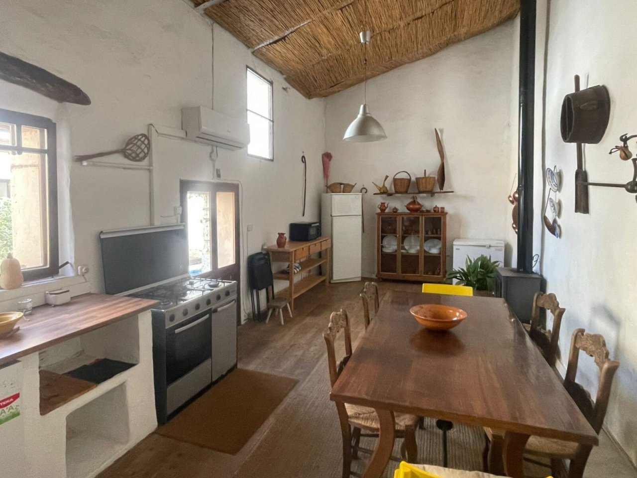 Open kitchen with high ceiling design – functional space concept for communal living