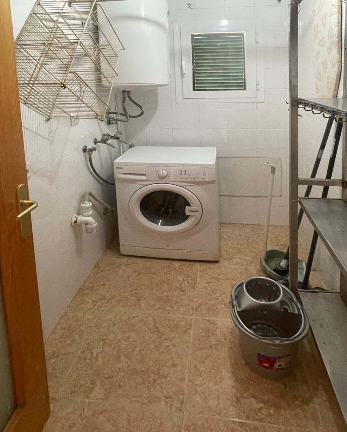 Practical laundry room with ready-to-use washing machine space and ventilation opening Practical laundry room with ready-to-use washing machine space and ventilation opening