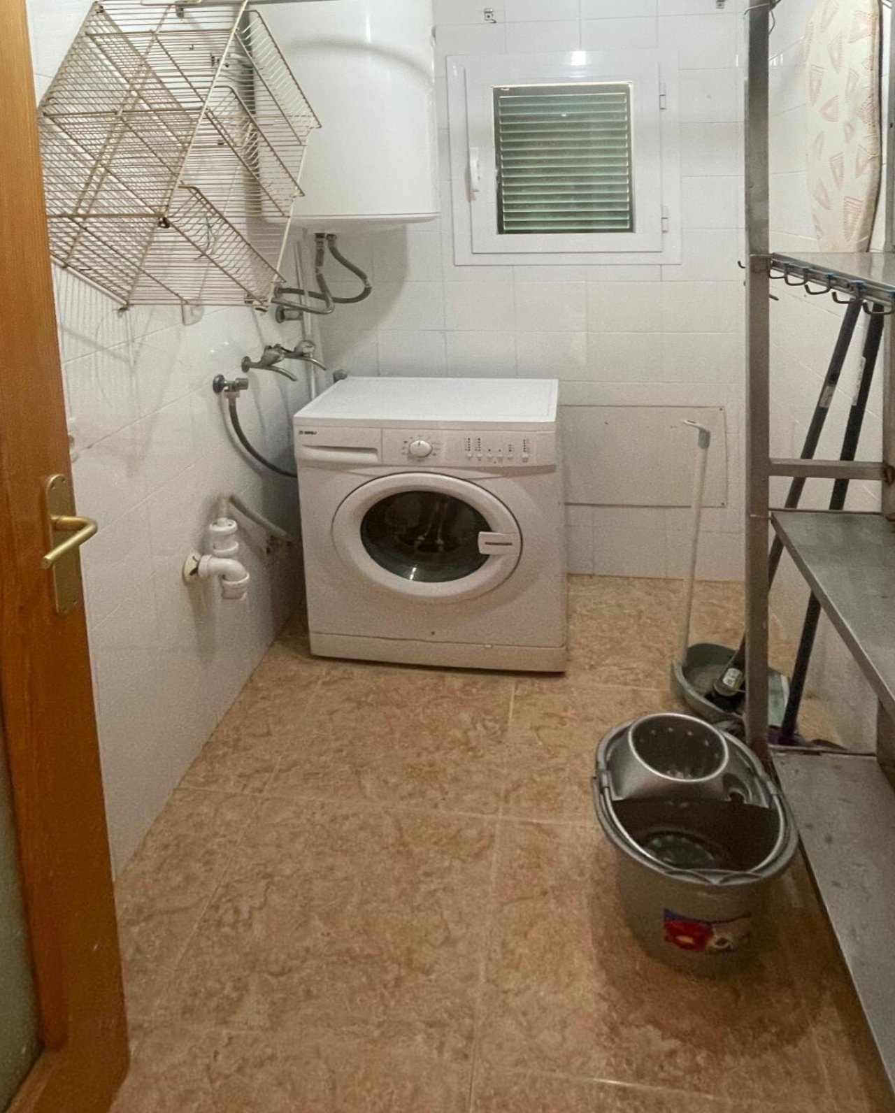 Practical laundry room with ready-to-use washing machine space and ventilation opening Practical laundry room with ready-to-use washing machine space and ventilation opening