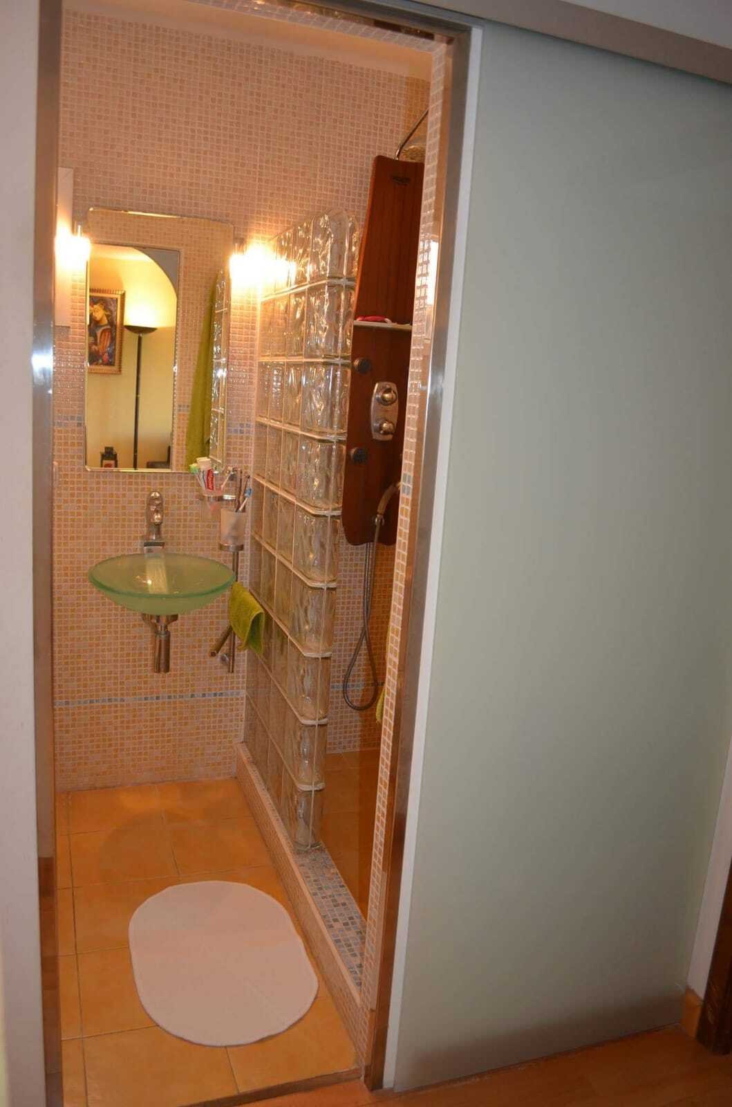 Modern bathroom with separate shower area and practical washbasin area Modern bathroom with separate shower area and practical washbasin area
