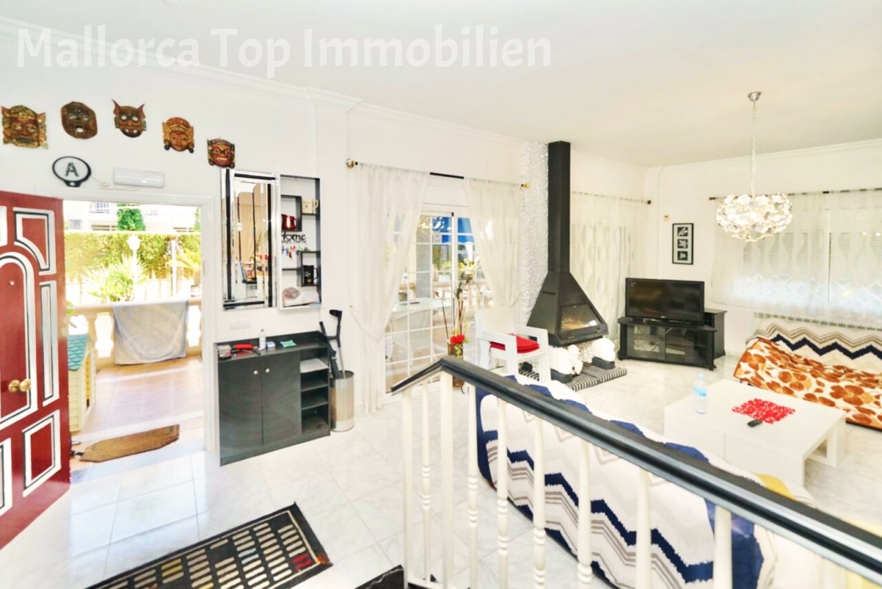 Open living and kitchen concept with fireplace – harmonious room connection for modern living