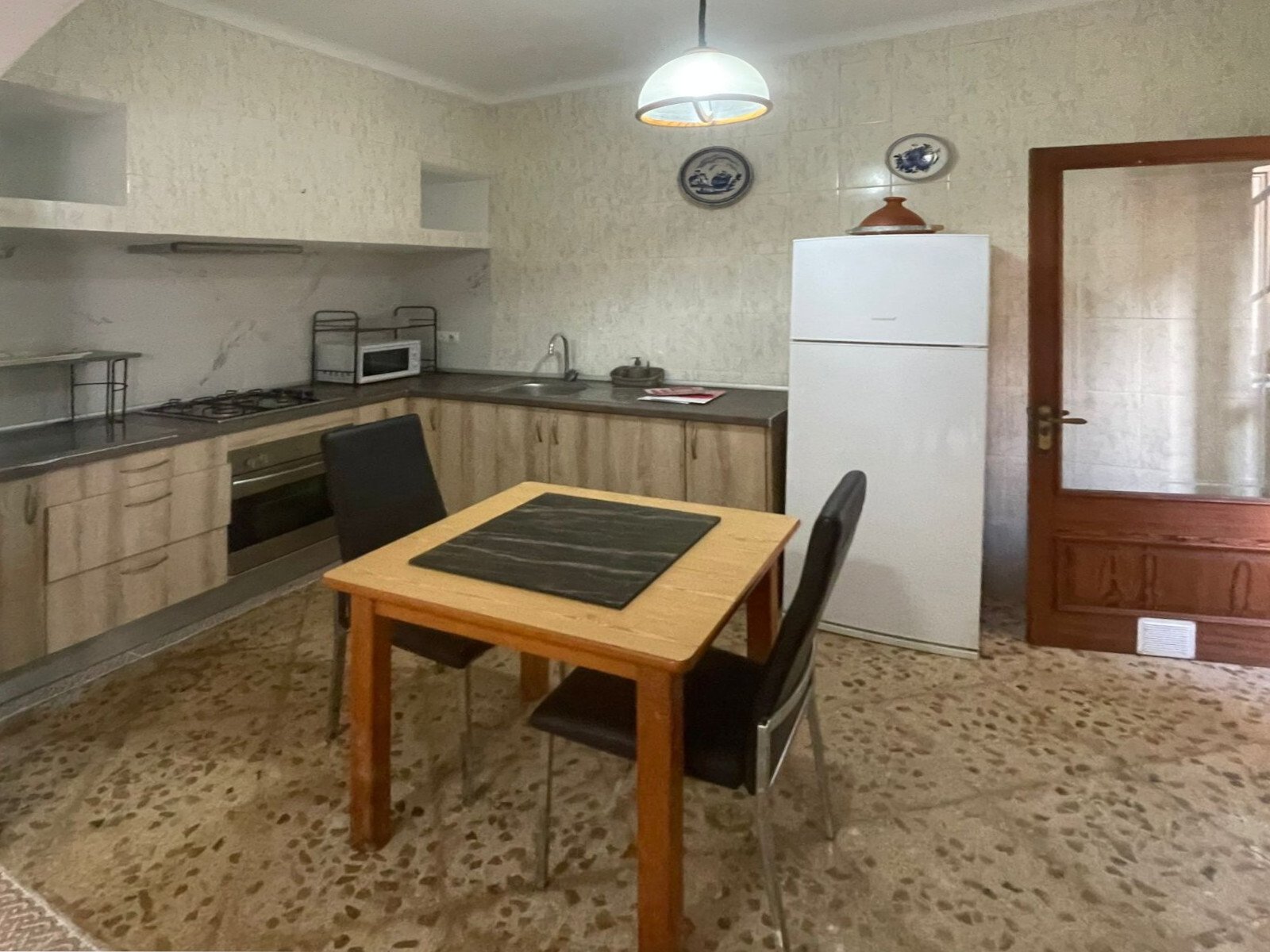 Functional kitchen with practical L-shape and direct access to the living area