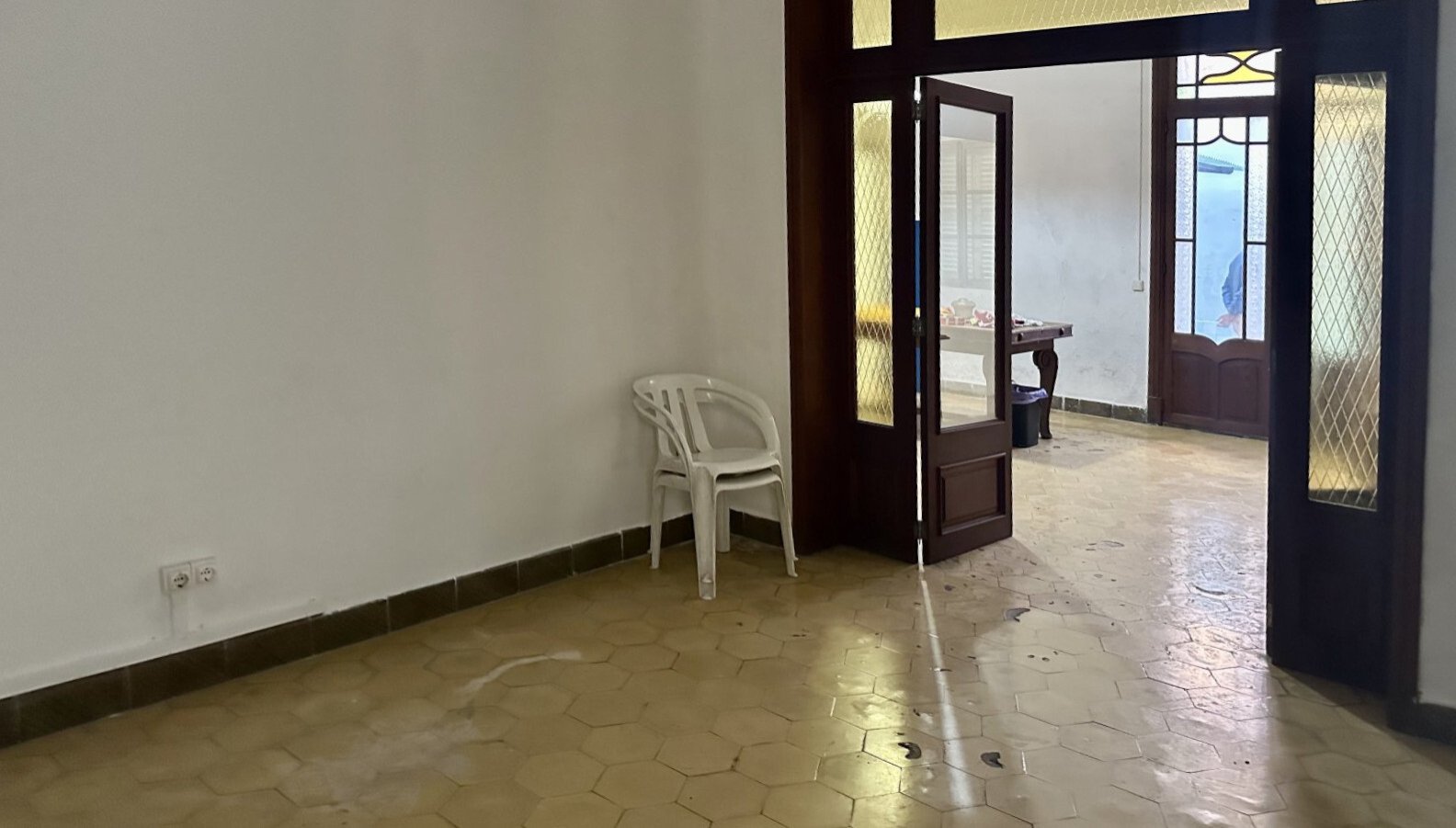 Passage area with elegant glass doors and flexible room layout