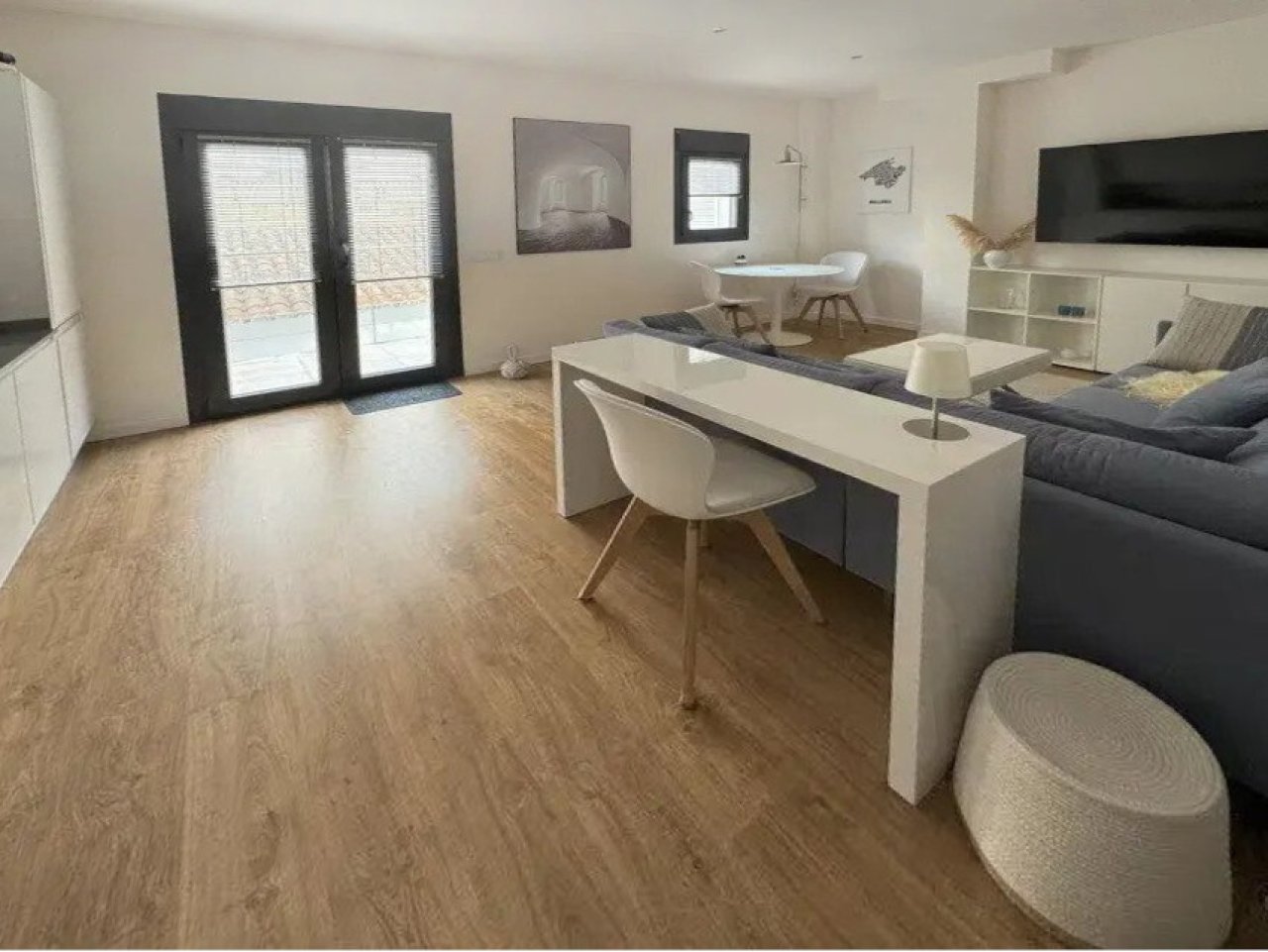 Living and working area with open floor plan and terrace access Living and working area with open floor plan and terrace access